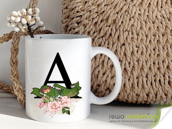Alphabet cup with banner and flowers