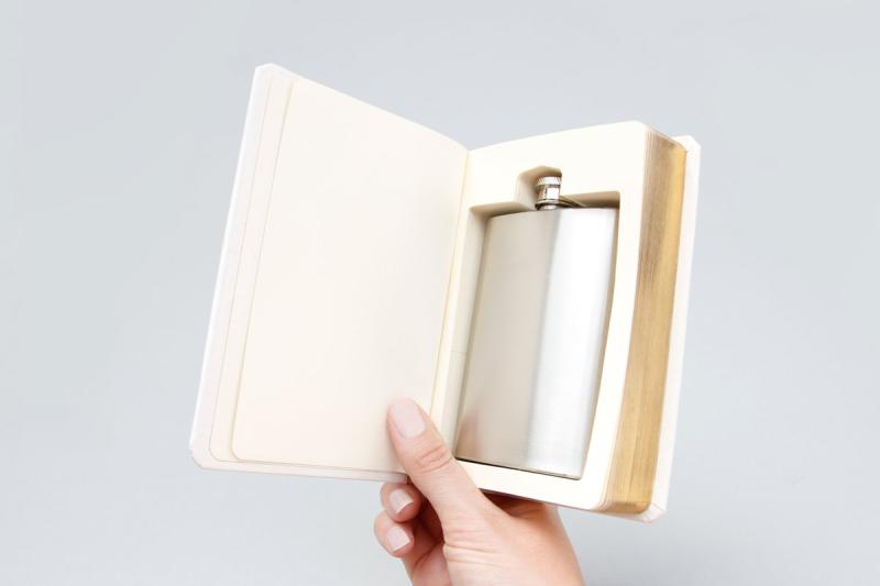 Flask in a white good book